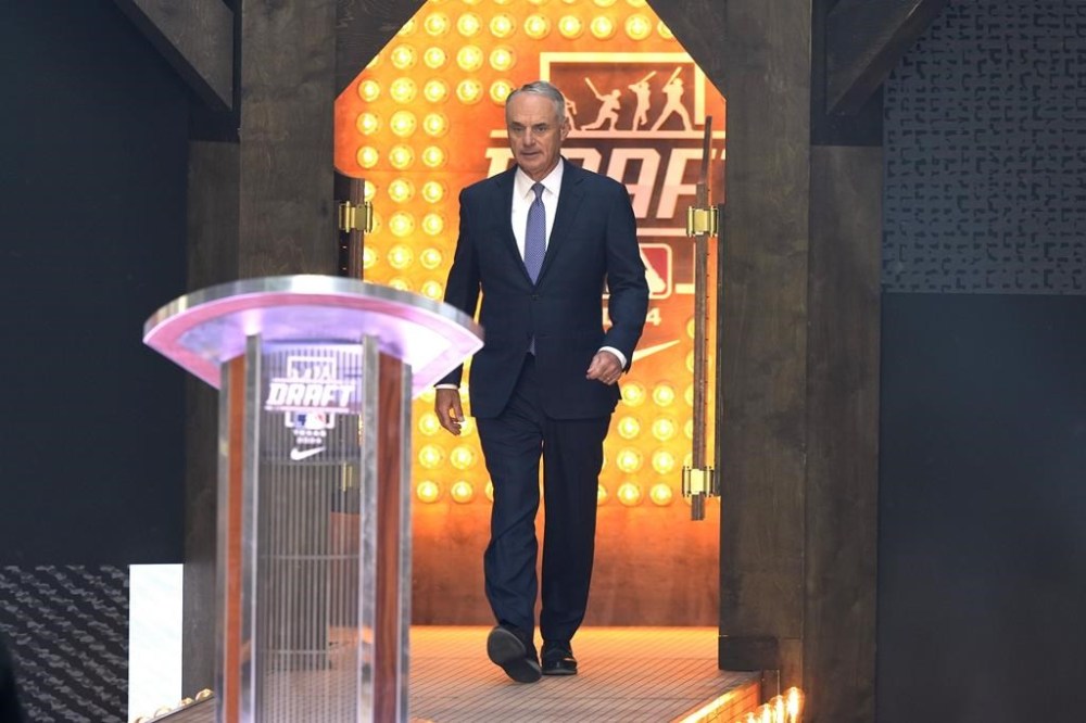 Major League Baseball Commissioner Rob Manfred walks up to the podium during the MLB baseball draft in Fort Worth, Texas, Sunday, July 14, 2024. (AP Photo/LM Otero)
