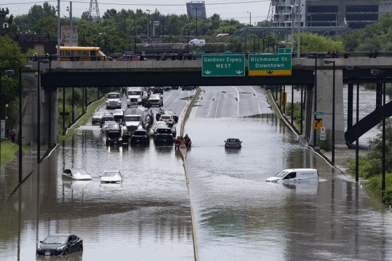 Cars are partially submerged in flood waters in the Don Valley following heavy rain in Toronto on Tuesday. (Arlyn McAdorey / The Canadian Press)