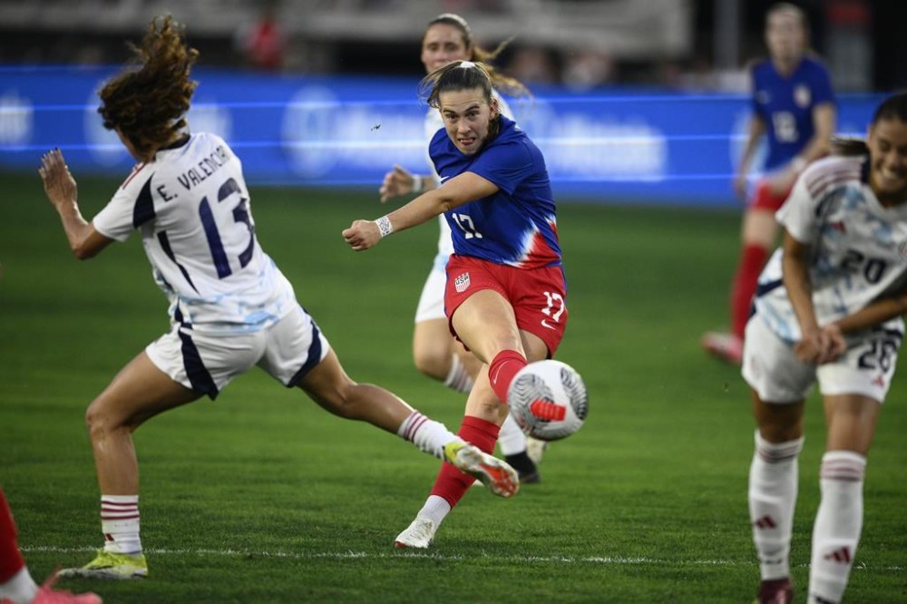 United States midfielder Sam Coffey (17) kicks the ball against Costa Rica midfielder Emilie Valenciano (13) during the first half of an international friendly soccer match, Tuesday, July 16, 2024, in Washington. (AP Photo/Nick Wass)