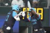 National League's Shohei Ohtani, of the Los Angeles Dodgers, left, celebrates his three-run home with Jurickson Profar, of the San Diego Padres, in the third inning during the MLB All-Star baseball game, Tuesday, July 16, 2024, in Arlington, Texas. (AP Photo/Julio Cortez)