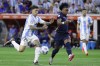 FILE - Ecuador's Angelo Preciado, right, and Argentina's Enzo Fernandez battle for the ball during a Copa America quarterfinal soccer match in Houston, Thursday, July 4, 2024. Chelsea has begun disciplinary action after midfielder Enzo Fernandez was involved in a video where members of Argentina's Copa America-winning squad appeared to sing about French players with African heritage. (AP Photo/Mike Wyke, File)