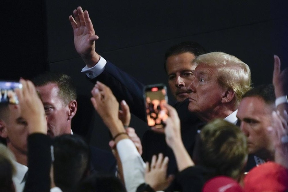FILE - Republican presidential candidate former President Donald Trump waves during the Republican National Convention Monday, July 15, 2024, in Milwaukee. (AP Photo/Charles Rex Arbogast, File)