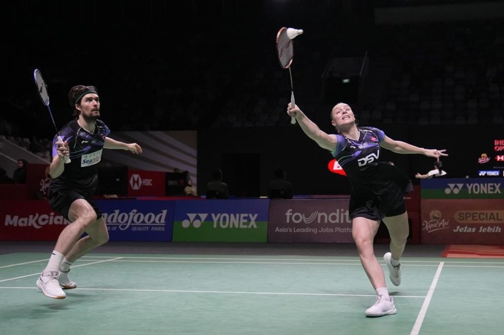 FILE - Denmark's Mathias Christiansen, left, and Alexandra Boje play mixed doubles against Japan's Yuta Watanabe and Arisa Higashino during the Indonesia Open badminton tournament Wednesday, June 5, 2024, at Istora Stadium in Jakarta, Indonesia. The Badminton World Federation confirmed Wednesday, July 17, that Christiansen has withdrawn from the Paris Olympics. (AP Photo/Dita Alangkara, File)