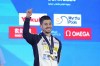 FILE - Gold medalist Giorgio Minisini of Italy, reacts during the medal ceremony for the men's solo free final of artistic swimming at the World Aquatics Championships in Doha, Qatar, Wednesday, Feb. 7, 2024. With no men picked to compete in artistic swimming at the Paris Olympics, where they are eligible for the first time, a former world champion is ending his career this week. At the Italian national championships, four-time worlds gold medalist Giorgio Minsini is competing for the last time at age 28. (AP Photo/Lee Jin-man, File)