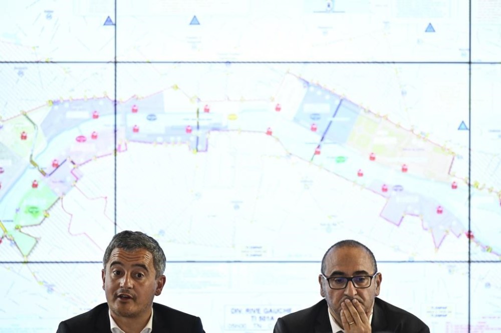 French Interior Gerald Darmanin, left, flanked by Paris police prefect Laurent Nunez, speaks during a meeting regarding the activation of the anti-terrorist perimeter (SILT) starting Thursday July 18, 2024, Wednesday July 17, 2024 in Paris, ahead of the Paris 2024 Olympic and Paralympic Games. (Julien de Rosa, Pool via AP)