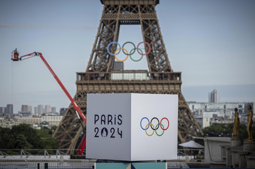 A majority of Canadians will watch this summer’s Paris Olympics in some capacity but only a small percentage will follow closely, according to a new national poll.
Polling firm Leger asked more than 1,500 people about their views of the upcoming Summer Games and their overall perceptions of the Olympics in an online survey conducted between July 12 and 14.The Olympic rings are seen on the Eiffel Tower, Sunday, July 14, 2024, in Paris. THE CANADIAN PRESS/AP/Aurelien Morissard