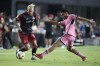 Toronto FC forward Federico Bernardeschi, left, attempts to keep control of the ball against Inter Miami midfielder Diego Gómez (20) during the second half of an MLS soccer match, Wednesday, July 17, 2024, in Fort Lauderdale, Fla. (AP Photo/Wilfredo Lee)
