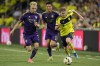 Nashville SC forward Jacob Shaffelburg, right, runs the ball past Orlando City midfielder Dagur Thorhallsson, left, and midfielder Cesar Araujo (5) during the second half of an MLS soccer match Wednesday, July 17, 2024, in Nashville, Tenn. Orlando City won 3-0. (AP Photo/George Walker IV)