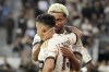 Los Angeles FC forward Cristian Olivera, left, Cele rates with midfielder Timothy Tillman after scoring a goal during the first half of a MLS soccer match against Real Salt Lake Wednesday, July 17, 2024, in Los Angeles. (AP Photo/Mark J. Terrill)