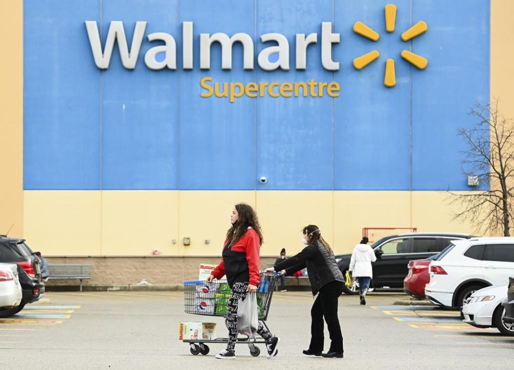 People leave a Walmart store in Mississauga, Ont., Thursday, Nov. 26, 2020. THE CANADIAN PRESS/Nathan Denette