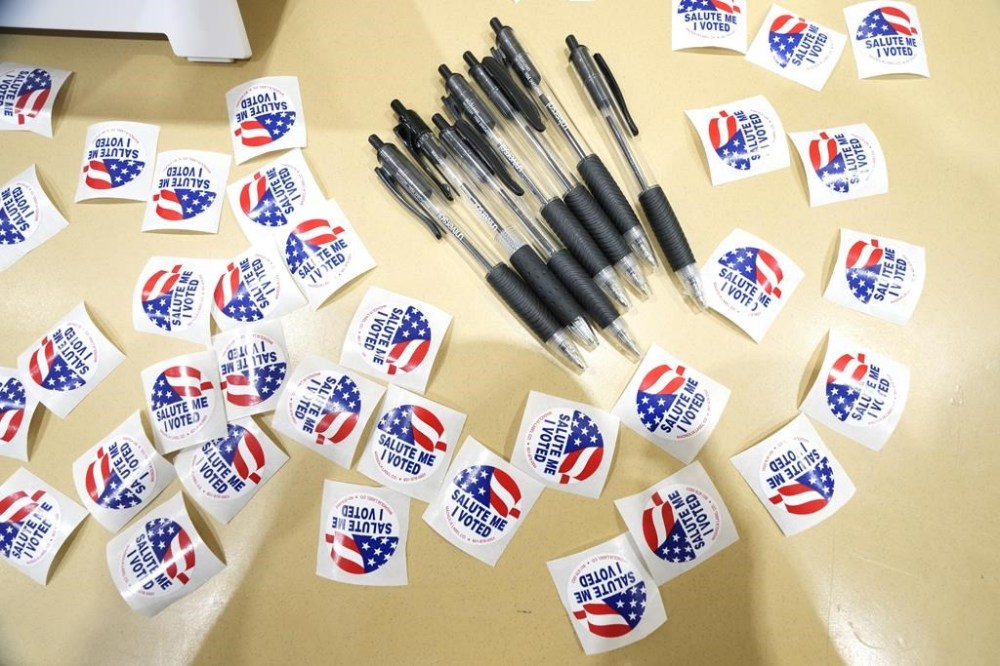 FILE - Pens are encircled by