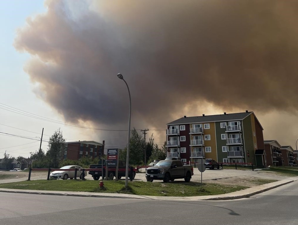 Smoke from a wildfire is shown in Labrador City, N.L. in a Friday, July 12, 2024 handout photo. Residents of Labrador City were ordered to evacuate Friday night, as a nearby wildfire crept closer to the town. THE CANADIAN PRESS/HO-Janelle Nippard **MANDATORY CREDIT**
