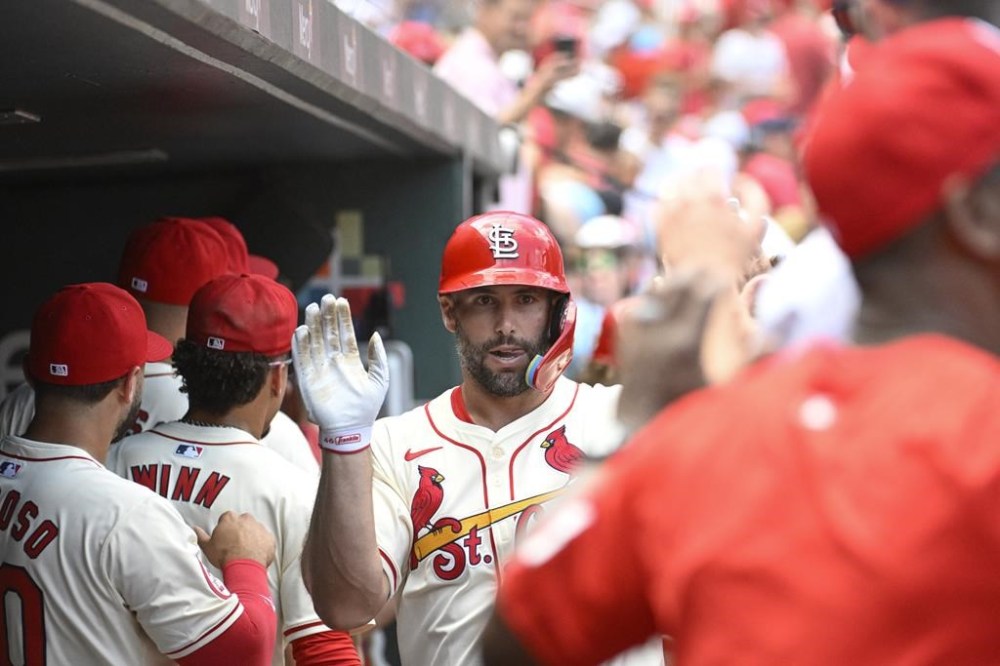 St. Louis Cardinals' Paul Goldschmidt, center, is congratulated after hitting a two-run home run in the first inning of a baseball game against the San Francisco Giants, Saturday June 22, 2024, in St. Louis. (AP Photo/Joe Puetz)
