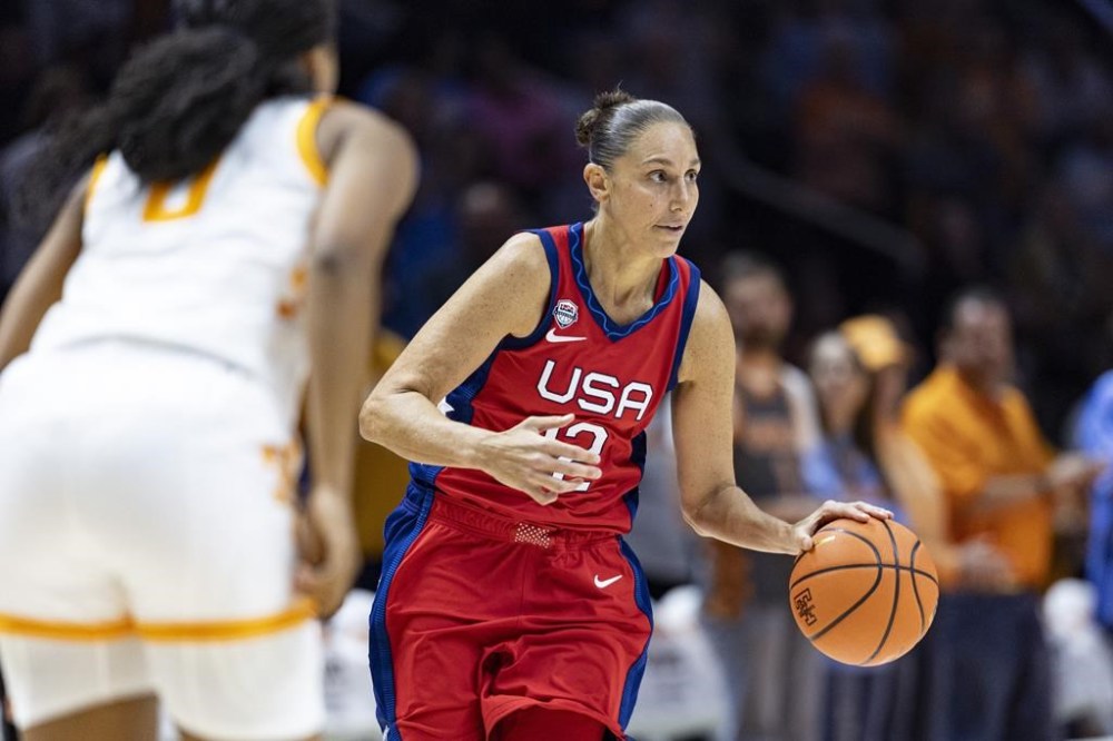 FILE - Team USA guard Diana Taurasi (12) brings the ball up court during the second half of an NCAA college basketball exhibition game against Tennessee, Sunday, Nov. 5, 2023, in Knoxville, Tenn. The 42-year-old guard will be playing in a record sixth Olympics when the U.S. goes for its eighth consecutive gold medal. (AP Photo/Wade Payne, File)
