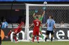 Canada moved up eight spots in the latest FIFA men's rankings after finishing fourth at the Copa America. Canada's Ismael Kone (8) scores his side's first goal against Uruguay during the Copa America third place soccer match in Charlotte, N.C., Saturday, July 13, 2024. THE CANADIAN PRESS/AP/Nell Redmond