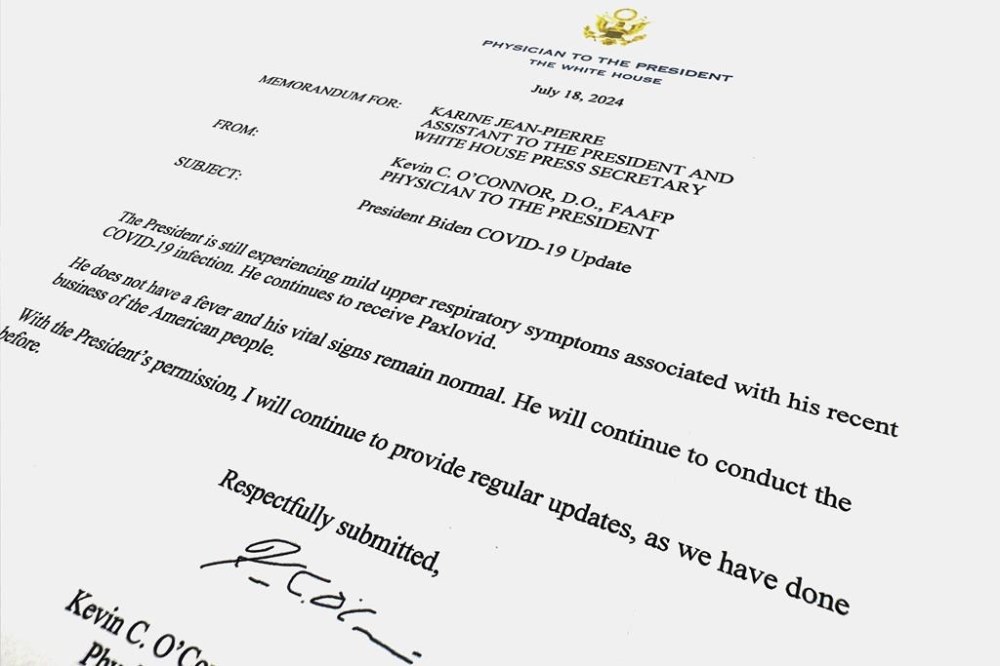 The memorandum released by the White House from President Joe Biden's physician Kevin C. O'Connor to White House press secretary Karine Jean-Pierre is photographed Thursday, July 18, 2024. O'Connor says that Biden continues to experience mild upper respiratory symptoms due to COVID-19, but doesn't have a fever and his vital signs are normal. (AP Photo/Jon Elswick)