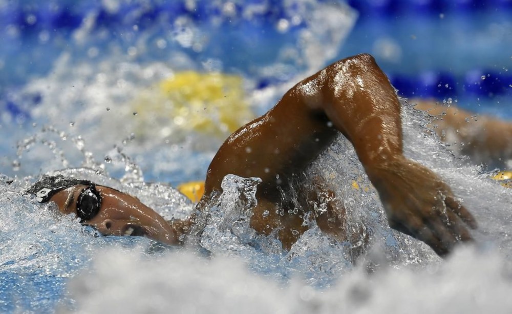 FILE - United States' Simone Manuel competes in a women's 100-meter freestyle semifinal during the swimming competitions at the 2016 Summer Olympics, Wednesday, Aug. 10, 2016, in Rio de Janeiro, Brazil. Manuel became the first Black female swimmer to claim an individual gold medal.(AP Photo/Martin Meissner, File)