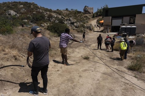 Attendees pull damaged fiber optic cables during the Tribal Broadband Bootcamp held on co-founder Matthew Rantanen's ranch in Aguanga, Calif., Wednesday, June 19, 2024. More than one in five homes on tribal lands lack access to adequate broadband, compared to fewer than one in 10 on non-tribal land in 2024, according to Federal Communications Commission data. But experts say the disparity is likely greater. (AP Photo/Jae C. Hong)