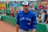 FILE - Toronto Blue Jays' Joey Votto walks to the dugout before a spring training baseball game against the Philadelphia Phillies, Sunday, March 17, 2024, in Clearwater, Fla. The Blue Jays infielder is scheduled to start for the Triple-A Buffalo Bisons on Friday, July 19, 2024, after missing time with ankle and lower back issues. (Steve Nesius/The Canadian Press via AP, File)