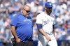 Toronto Blue Jays relief pitcher Yimi Garcia walks back to the dug out with a member of the Blue Jays medical staff during ninth inning American League MLB baseball action in Toronto on June 16, 2024. THE CANADIAN PRESS/Chris Young