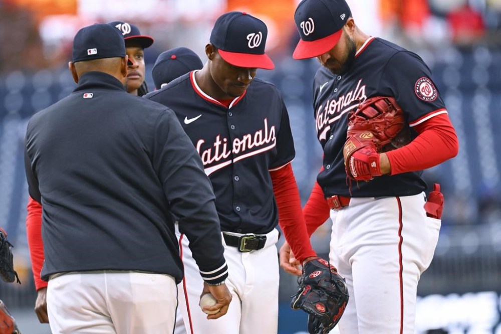 FILE - Washington Nationals starting pitcher Josiah Gray, center, leaves during the fifth inning of a baseball game against the Pittsburgh Pirates at Nationals Park, Thursday, April 4, 2024, in Washington. Gray will have season-ending surgery for a partial tear of the ulnar collateral ligament in his pitching elbow, the team announced Friday, July 19, 2024. (AP Photo/John McDonnell, FIle)