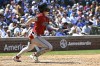 Arizona Diamondbacks' Corbin Carroll drives in a run with a sacrifice fly in the fifth inning of a baseball game against the Chicago Cubs, Friday, July 19, 2024, in Chicago. (AP Photo/Matt Marton)