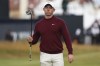 Rory McIlroy of Northern Ireland walks off the 18th green following his second round of the British Open Golf Championships at Royal Troon golf club in Troon, Scotland, Friday, July 19, 2024. (AP Photo/Scott Heppell)