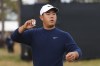 Tom Kim of Korea throws his ball into the stands after finishing his second round of the British Open Golf Championships at Royal Troon golf club in Troon, Scotland, Friday, July 19, 2024. (AP Photo/Scott Heppell)
