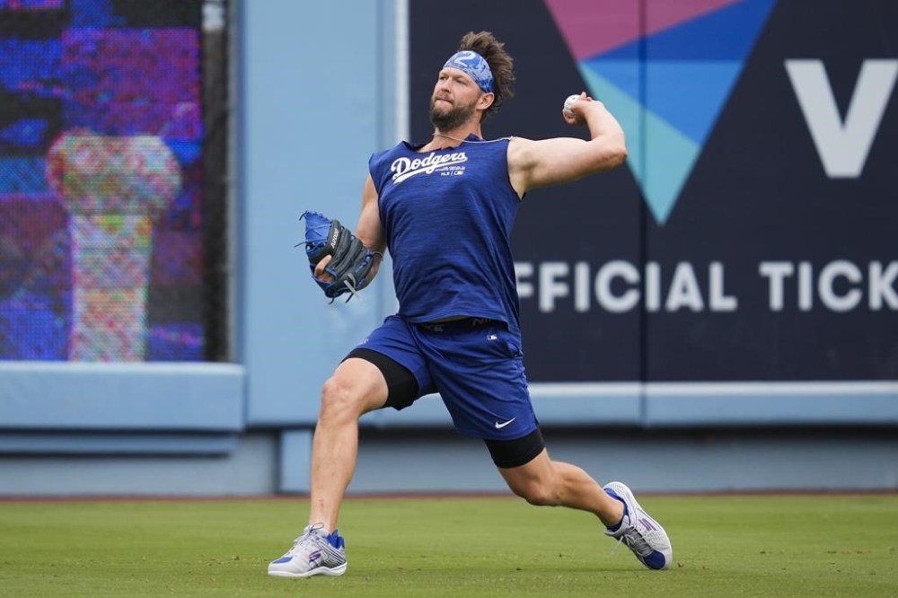 FILE - Los Angeles Dodgers' Clayton Kershaw works out before a baseball game against the Colorado Rockies in Los Angeles, Sunday, June 2, 2024. Los Angeles Dodgers left-hander Kershaw made a second rehab start in his bid to return from offseason left shoulder surgery, pitching four innings for Triple-A Oklahoma City against Round Rock.(AP Photo/Ashley Landis, File)