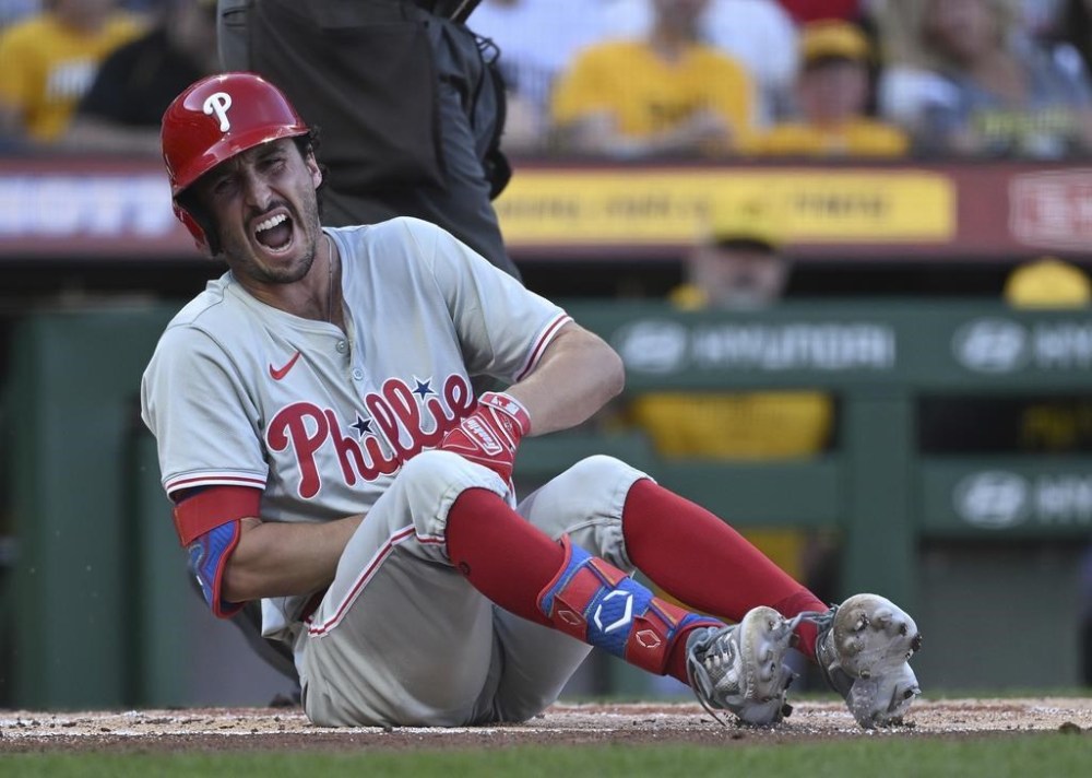 Philadelphia Phillies' Garrett Stubbs reacts after being hit by a pitch in the first inning of a baseball game against the Pittsburgh Pirates in Pittsburgh, Friday, July 19, 2024. (AP Photo/Justin Berl)