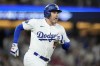 Los Angeles Dodgers' Freddie Freeman heads to first after hitting a grand slam during the eighth inning of a baseball game against the Boston Red Sox Friday, July 19, 2024, in Los Angeles. (AP Photo/Mark J. Terrill)