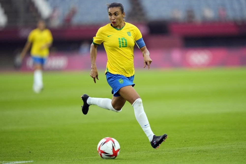 FILE - Brazil's Marta dribbles the ball during a women's soccer match against China at the 2020 Summer Olympics, Wednesday, July 21, 2021, in Rifu, Japan. The Brazilian legend plays in her final Olympics in France before stepping away from the national team. (AP Photo/Andre Penner, File)