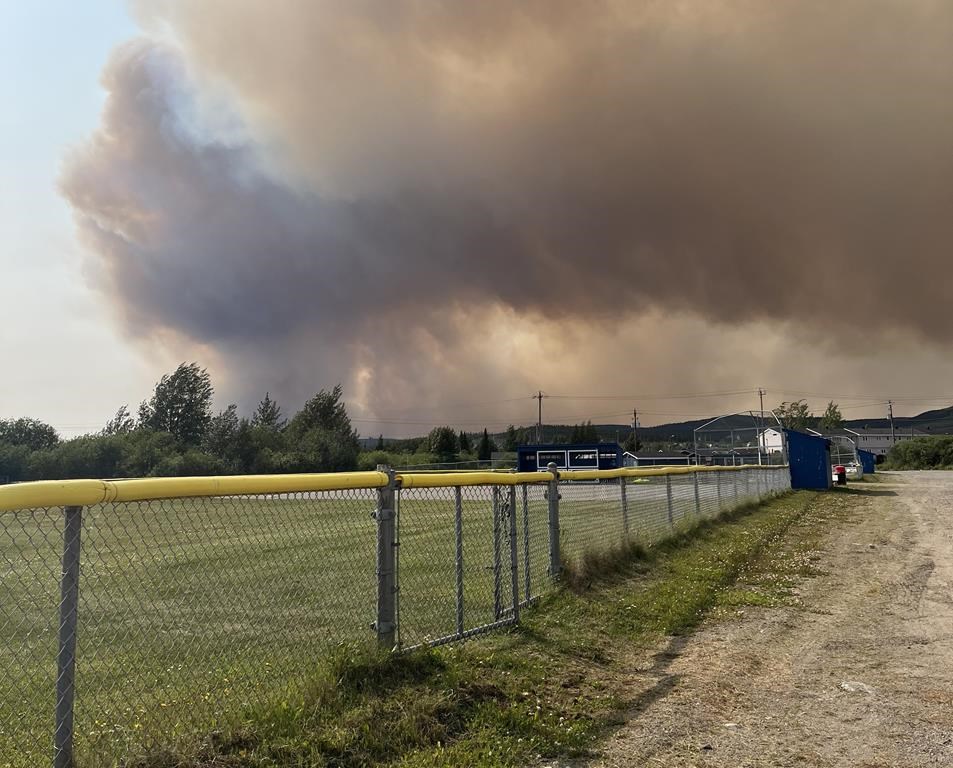 Newfoundland and Labrador Premier Andrew Furey says some Labrador City residents will be allowed to return home after a wildfire forced them to evacuate last week. Smoke from a wildfire is shown in Labrador City, N.L. in a Friday, July 12, 2024 handout photo. THE CANADIAN PRESS/HO-Janelle Nippard **MANDATORY CREDIT**