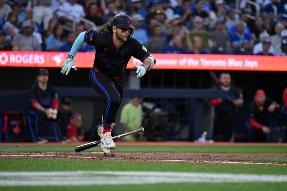 Toronto Blue Jays shortstop Bo Bichette runs out a single against the Detroit Tigers during fifth inning American League baseball action in Toronto on Friday, July 19, 2024. The Blue Jays placed Bichette on the 10-day injured list with a right calf strain on Saturday. THE CANADIAN PRESS/Jon Blacker