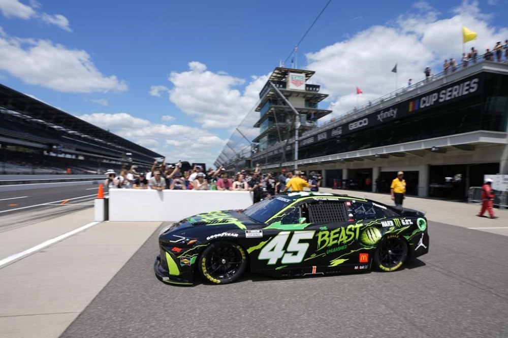Tyler Reddick pulls out of the garage area during a practice session for the NASCAR Cup Series auto race at Indianapolis Motor Speedway, Friday, July 19, 2024, in Indianapolis. (AP Photo/Darron Cummings)