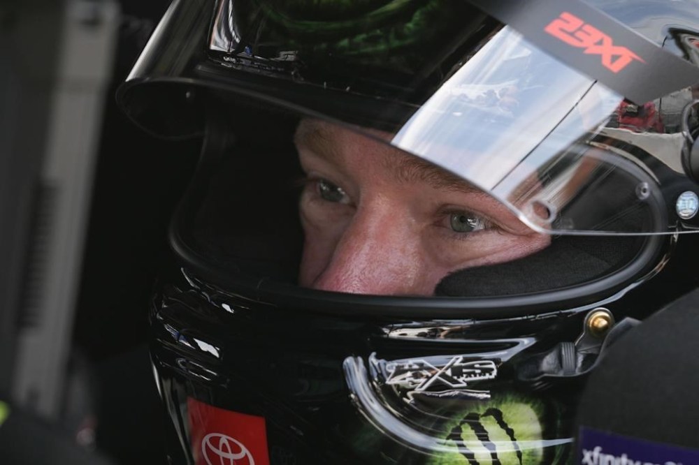 Tyler Reddick sits in his car during qualifications for the NASCAR Cup Series auto race at Indianapolis Motor Speedway, Saturday, July 20, 2024, in Indianapolis. (AP Photo/Darron Cummings)