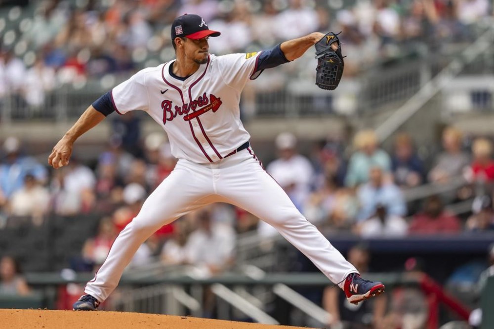 Atlanta Braves pitcher Charlie Morton (50) throws during the first inning in the first baseball game of a doubleheader against the St. Louis Cardinals, Saturday, July 20, 2024, in Atlanta. (AP Photo/Jason Allen)