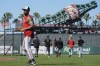 Minnesota Twins' Carlos Correa, left, warms up before a baseball game against the San Francisco Giants, Friday, July 12, 2024, in San Francisco. (AP Photo/Godofredo A. Vásquez)