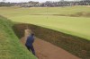 Shane Lowry of Ireland plays from a bunker on the eighth hole during his third round of the British Open Golf Championships at Royal Troon golf club in Troon, Scotland, Saturday, July 20, 2024. (AP Photo/Peter Morrison)