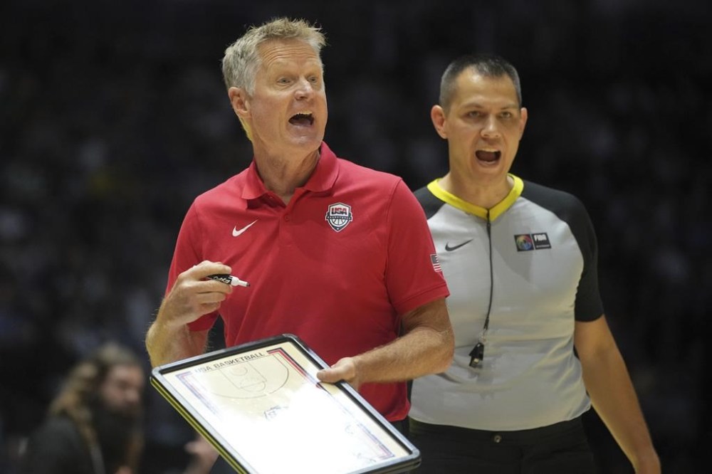 United States' head coach Steve Kerr gestures to his players during an exhibition basketball game between the United States and South Sudan, at the o2 Arena in London, Saturday, July 20, 2024. (AP Photo/Kin Cheung)