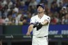 Texas Rangers starting pitcher Max Scherzer reacts after walking Baltimore Orioles' Ryan O'Hearn during the second inning of a baseball game, Saturday, July 20, 2024, in Arlington, Texas. The Orioles scored four runs in the inning. (AP Photo/Jeffrey McWhorter)