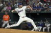 Texas Rangers starting pitcher Max Scherzer works against the Baltimore Orioles during the first inning of a baseball game Saturday, July 20, 2024, in Arlington, Texas. (AP Photo/Jeffrey McWhorter)