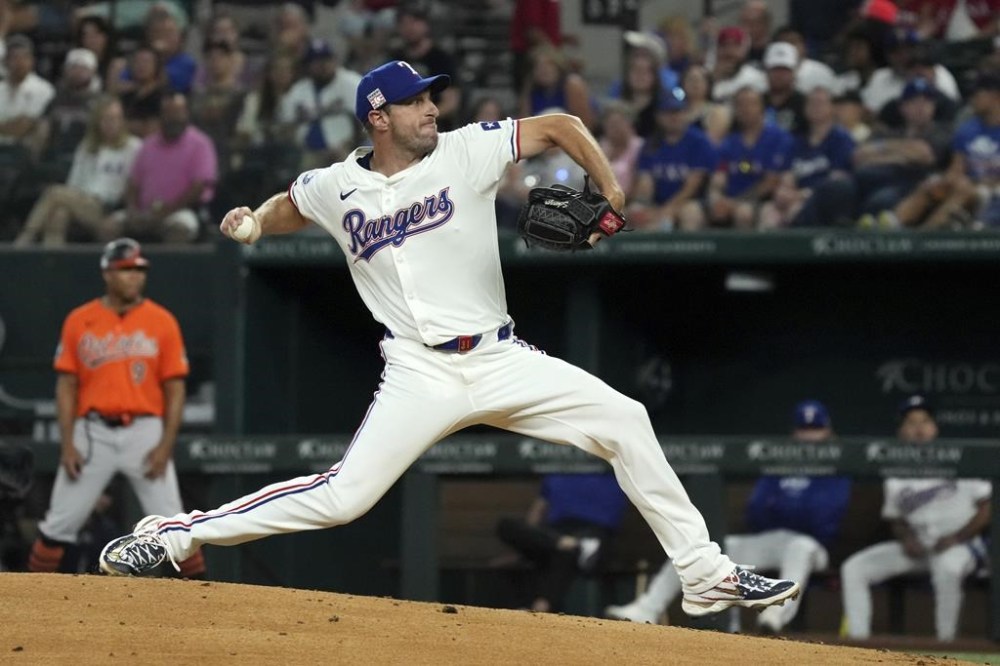 Texas Rangers starting pitcher Max Scherzer works against the Baltimore Orioles during the first inning of a baseball game Saturday, July 20, 2024, in Arlington, Texas. (AP Photo/Jeffrey McWhorter)