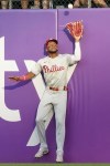 Philadelphia Phillies center fielder Johan Rojas catches a fly ball hit by Pittsburgh Pirates' Nick Gonzales during the fourth inning of a baseball game Saturday, July 20, 2024, in Pittsburgh. (AP Photo/Matt Freed)