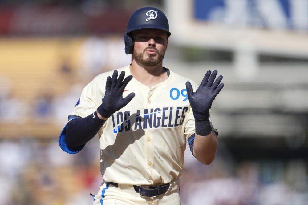 Los Angeles Dodgers' Gavin Lux celebrates as he rounds the bases following his solo home run during the second inning of a baseball game against the Boston Red Sox, Saturday, July 20, 2024, in Los Angeles. (AP Photo/Marcio Jose Sanchez)
