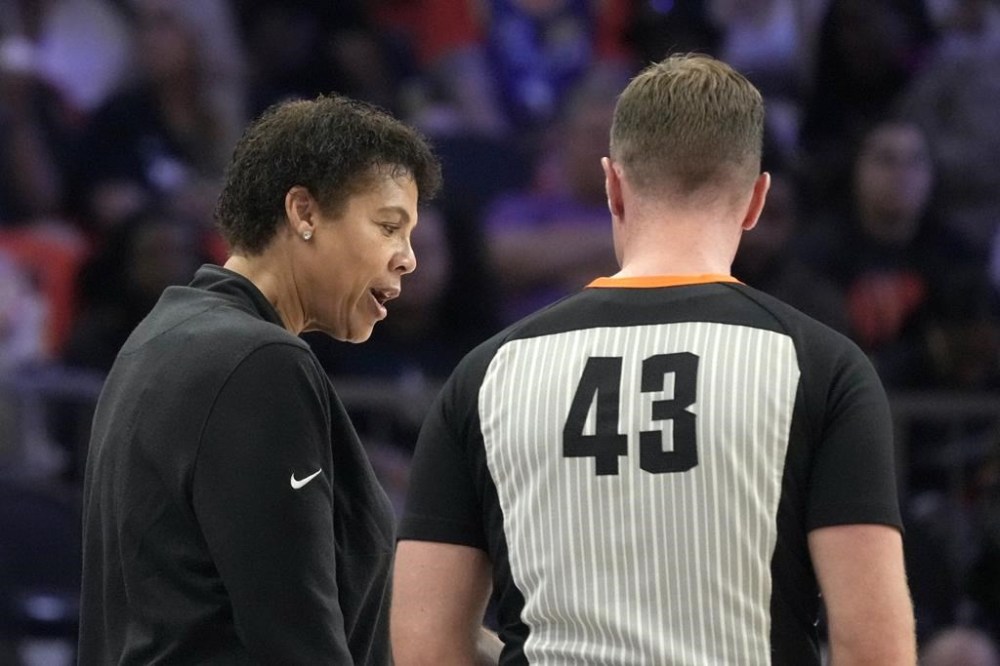 Team WNBA head coach Cheryl Miller, left, argues with referee Kevin Fahy (43) during the second half of a WNBA All-Star basketball game against Team USA, Saturday, July 20, 2024, in Phoenix. (AP Photo/Ross D. Franklin)