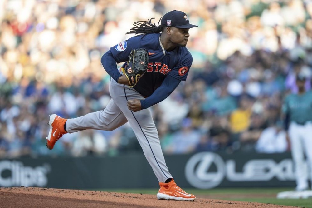 Houston Astros starter Framber Valdez delivers a pitch during the first inning of a baseball game against the Seattle Mariners, Saturday, July 20, 2024, in Seattle. (AP Photo/Stephen Brashear)