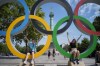 Kids play in Olympic rings set up on Place de la Bastille, Friday, July 19, 2024, in Paris, France. The International Olympic and Paralympic committees allowing some Russian and Belarusian athletes entry into the 2024 Summer Games is a thorny topic. THE CANADIAN PRESS/AP/David Goldman
