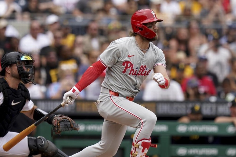 Philadelphia Phillies' Bryce Harper watches his single during the fifth inning of a baseball game against the Pittsburgh Pirates, Sunday, July 21, 2024, in Pittsburgh. (AP Photo/Matt Freed)