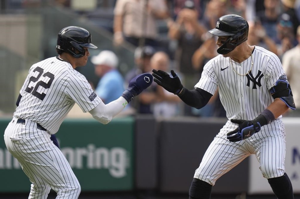 New York Yankees' Aaron Judge, right, celebrates his three-run home run with Juan Soto during the seventh inning of the baseball game against the Tampa Bay Rays, Sunday, July 21, 2024, in New York. (AP Photo/Seth Wenig)